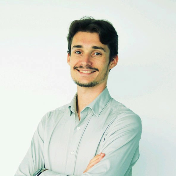 Picture of Nicolas Martou; Brown hair, white guy and a shirt on him